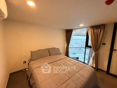 Cozy bedroom with city view and modern decor