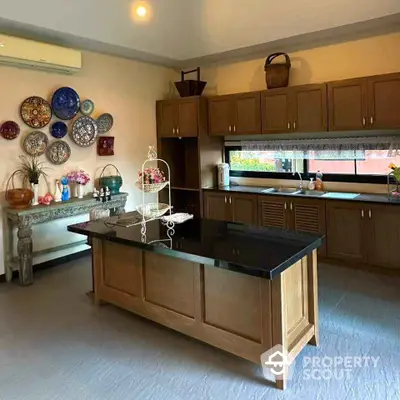 Charming kitchen with elegant wooden cabinetry and decorative wall plates