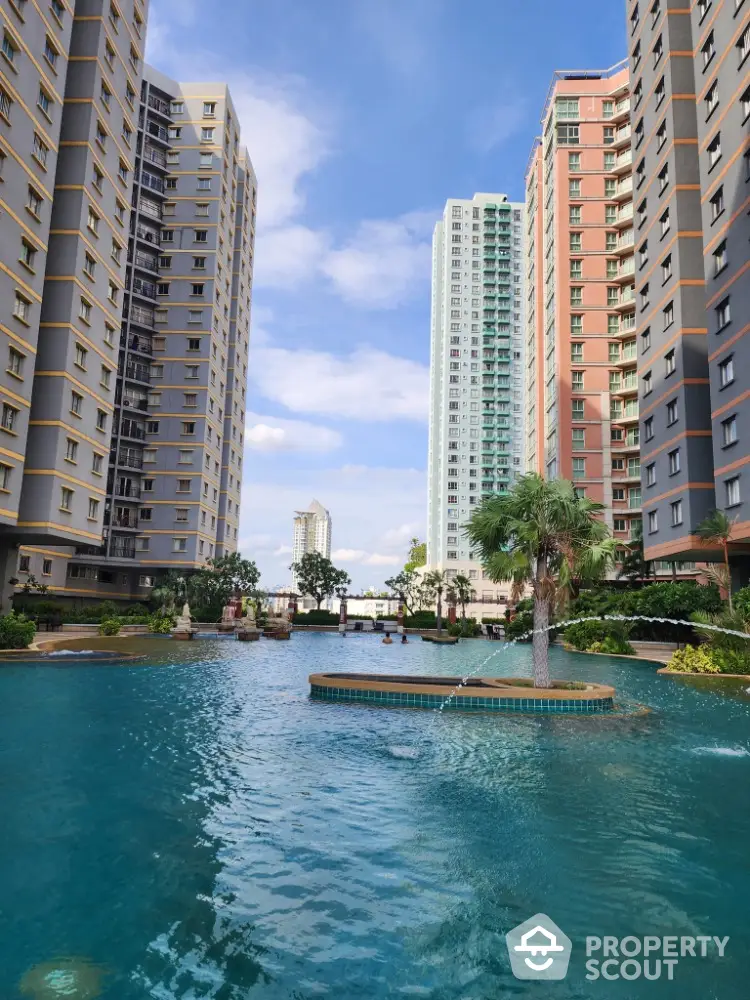 Luxurious high-rise apartment complex with stunning pool and lush landscaping