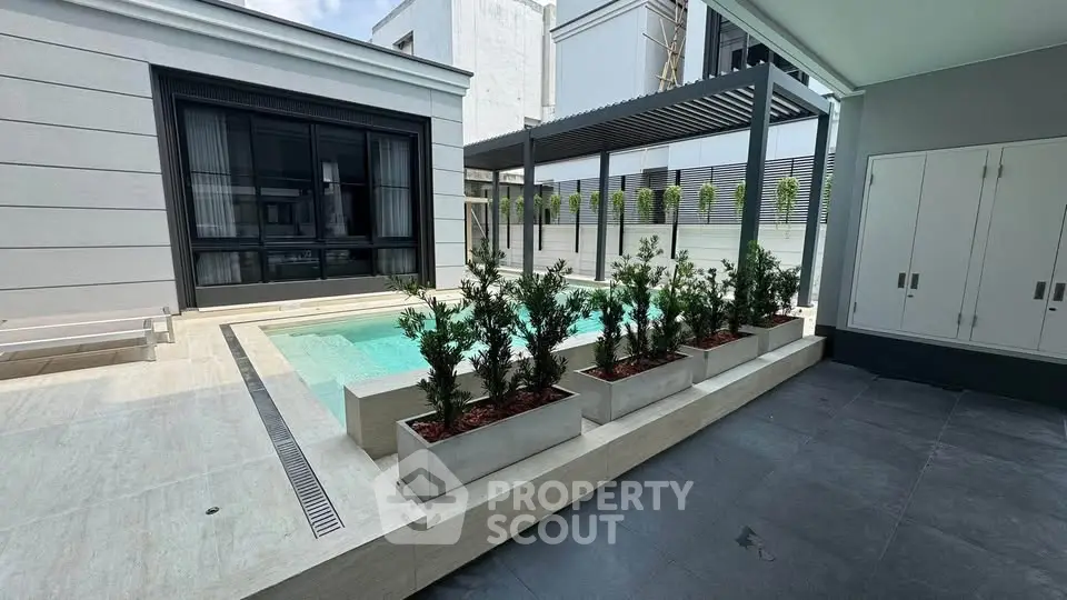 Luxurious modern home with private pool and stylish outdoor area, perfect for relaxation and entertainment.