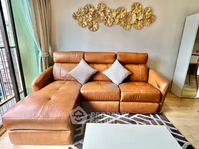 Luxurious living room with elegant leather sofa and stylish decor in modern apartment.