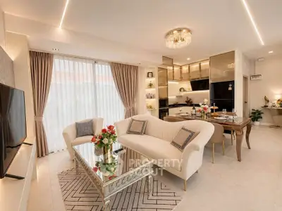 Luxurious open-plan living room with elegant decor and modern kitchen