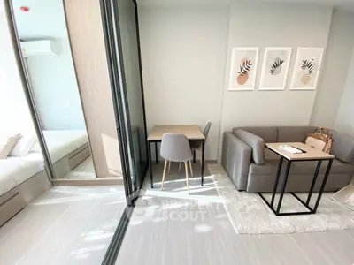 Modern studio apartment with cozy living area and stylish decor