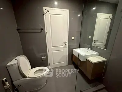 Modern bathroom with sleek design and elegant fixtures in a contemporary home.