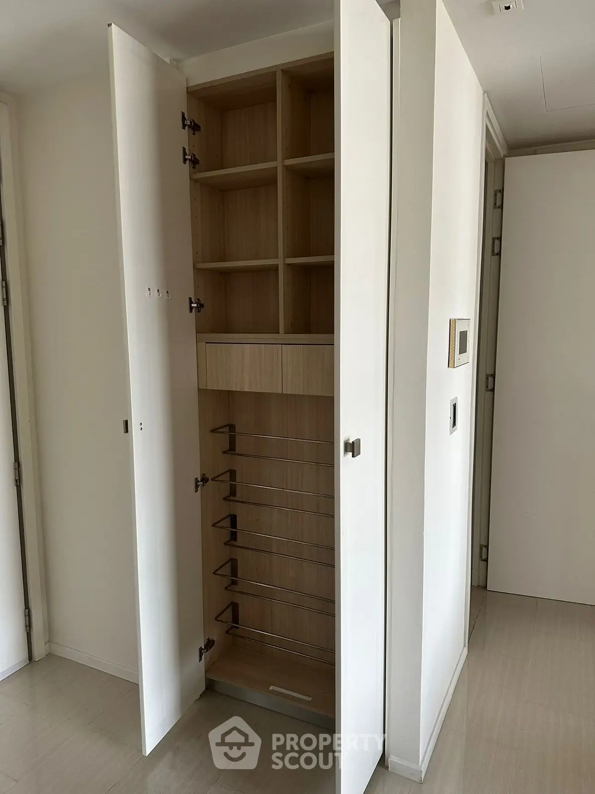 Modern built-in storage cabinet with open shelving and sleek design