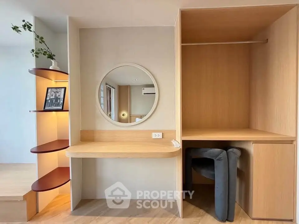 Modern study nook with built-in desk and shelving in stylish apartment