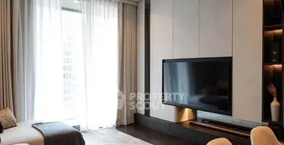 Luxurious modern living room with large TV and elegant decor