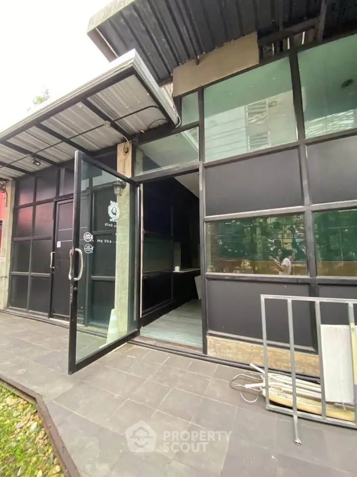 Modern commercial building entrance with glass doors and sleek design
