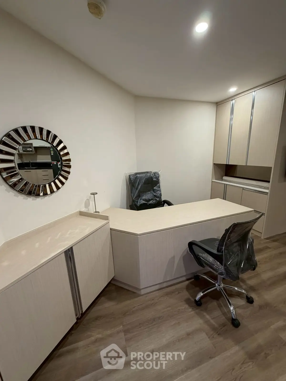 Modern study room with sleek desk and stylish chairs, perfect for productivity and focus.