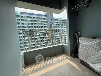 Spacious balcony with city view in modern apartment building