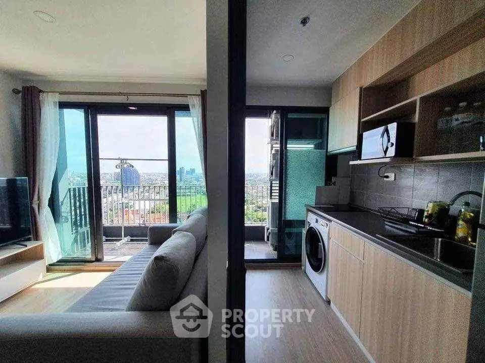 Modern apartment with open kitchen and stunning city view from balcony
