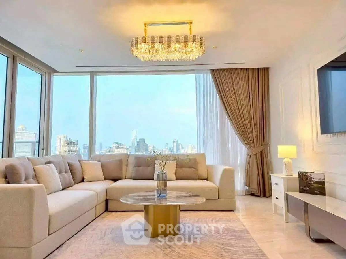 Luxurious living room with panoramic city view and elegant chandelier