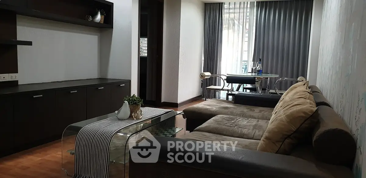 Spacious living room with modern decor and large windows for natural light.
