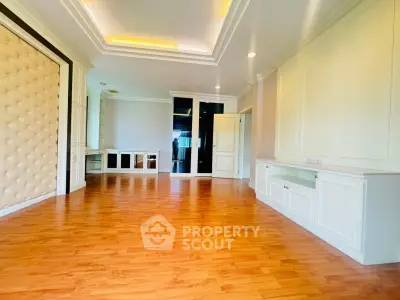 Spacious and elegant living room with wooden flooring and modern design