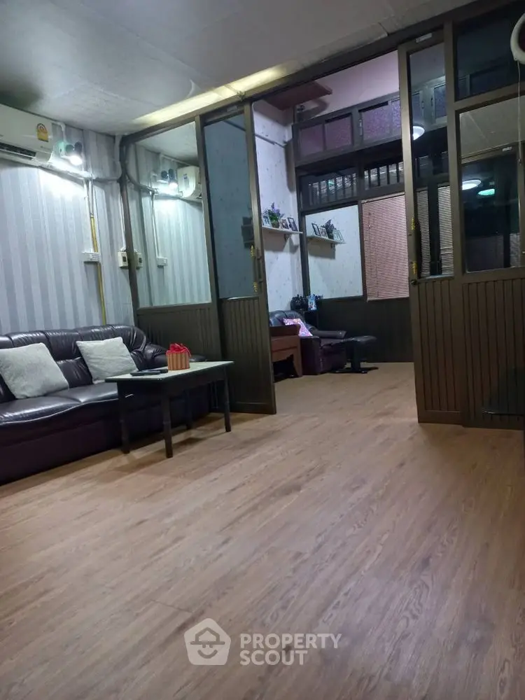 Spacious living room with wooden flooring and modern decor