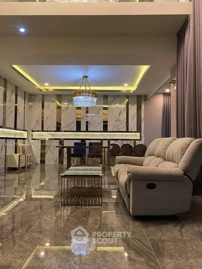 Luxurious modern living room with marble flooring and elegant chandelier
