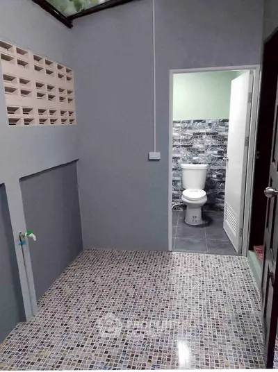 Modern bathroom with tiled floor and open layout