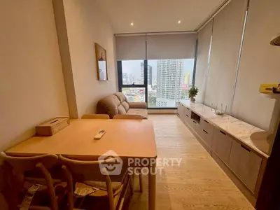 Modern living room with panoramic city view and stylish furniture.