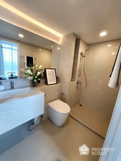 Modern bathroom with sleek fixtures and elegant lighting