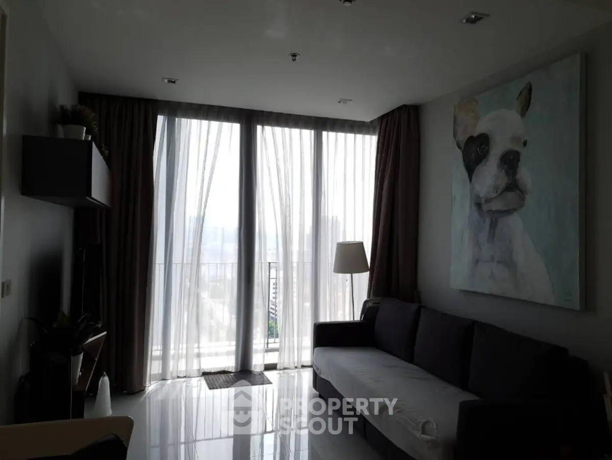 Modern living room with large windows and stylish decor