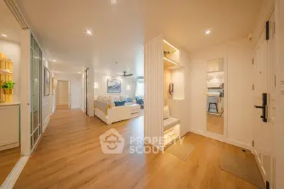 Spacious modern living room with wooden flooring and cozy seating area