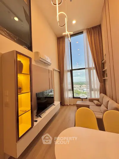 Luxurious high-ceiling living room with panoramic window view and modern decor