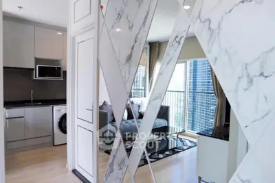 Modern apartment with stylish marble accents and city view balcony