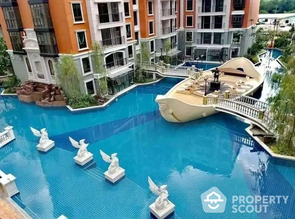 Luxurious apartment complex with stunning pool and unique boat feature