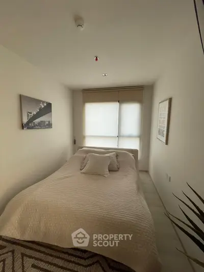 Cozy minimalist bedroom with modern decor and natural light