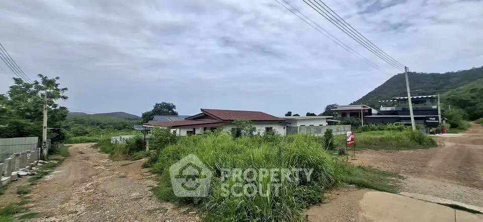 Scenic rural property with lush greenery and mountain views, ideal for tranquil living.