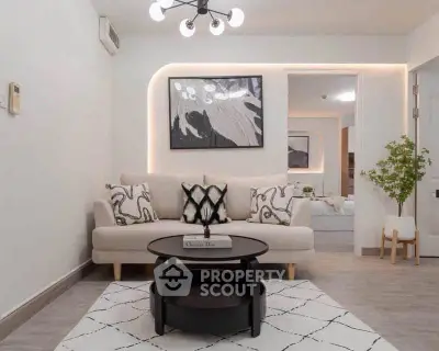 Modern living room with stylish decor and cozy seating area, perfect for relaxation and entertaining.