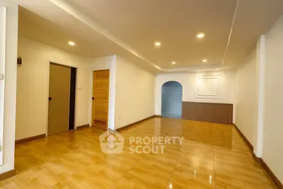 Spacious modern living room with wooden flooring and recessed lighting