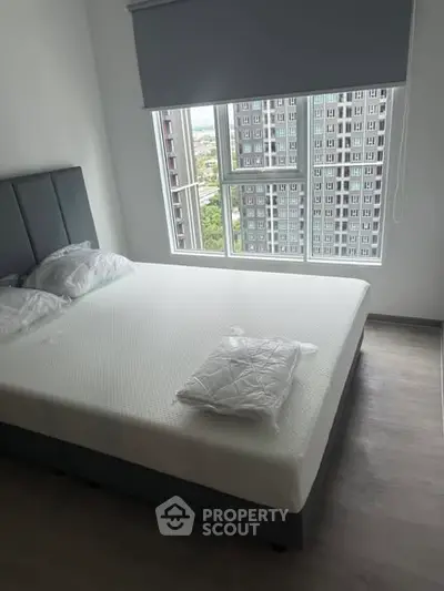 Modern bedroom with city view and stylish decor