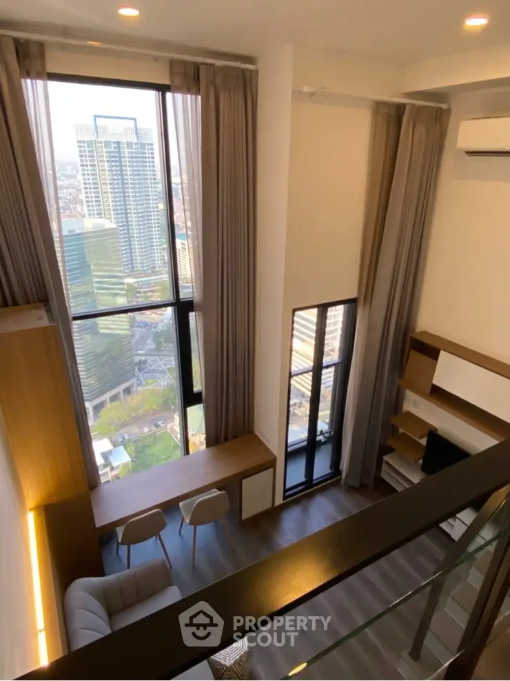 Stunning high-rise apartment with floor-to-ceiling windows and breathtaking city views.