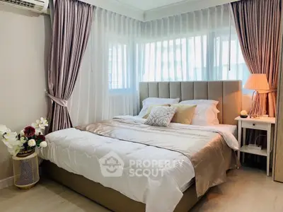 Luxurious bedroom with elegant decor and natural light
