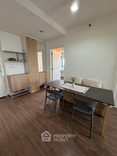 Modern dining area with wooden flooring and stylish furniture