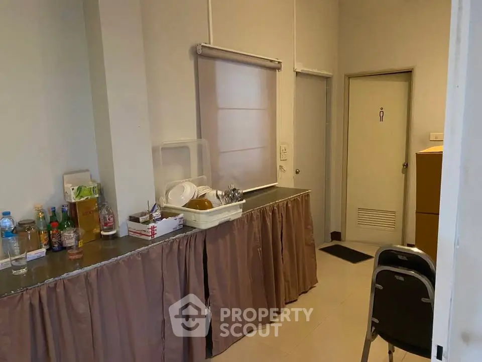Cozy kitchen area with closed layout and essential amenities