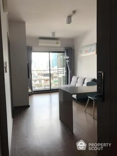 Modern living room with city view and sleek furniture in a high-rise apartment