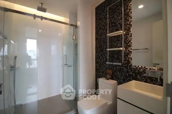 Modern bathroom with glass shower and sleek design