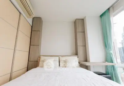 Modern bedroom with large windows and city view, featuring minimalist design and cozy ambiance.