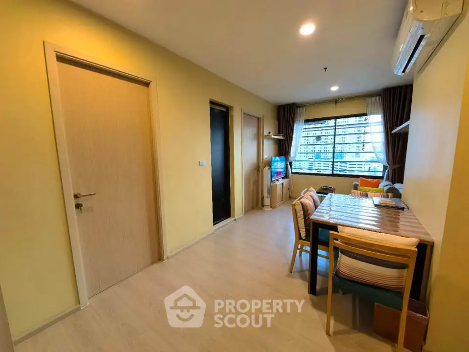 Cozy living room with modern decor and natural light, perfect for relaxation and entertainment.