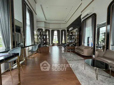 Luxurious living room with elegant decor and large windows in a modern apartment.