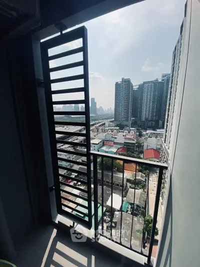 Stunning urban view from a modern balcony in a high-rise building, perfect for city living.