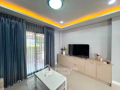 Modern living room with sleek TV setup and elegant lighting