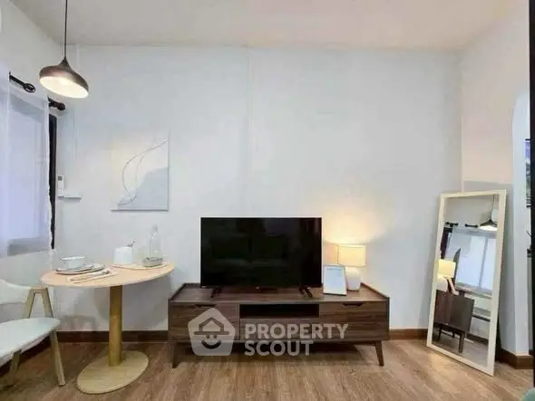 Modern living room with stylish decor and wooden flooring