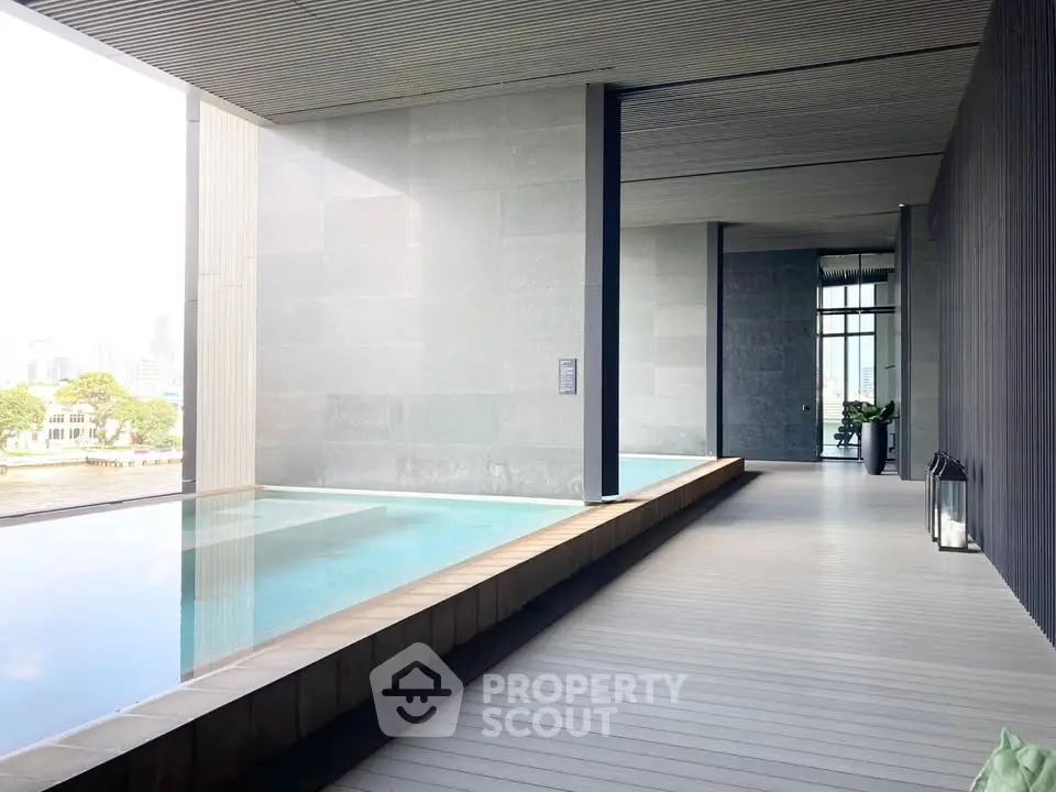 Luxurious modern pool area with sleek design and city view