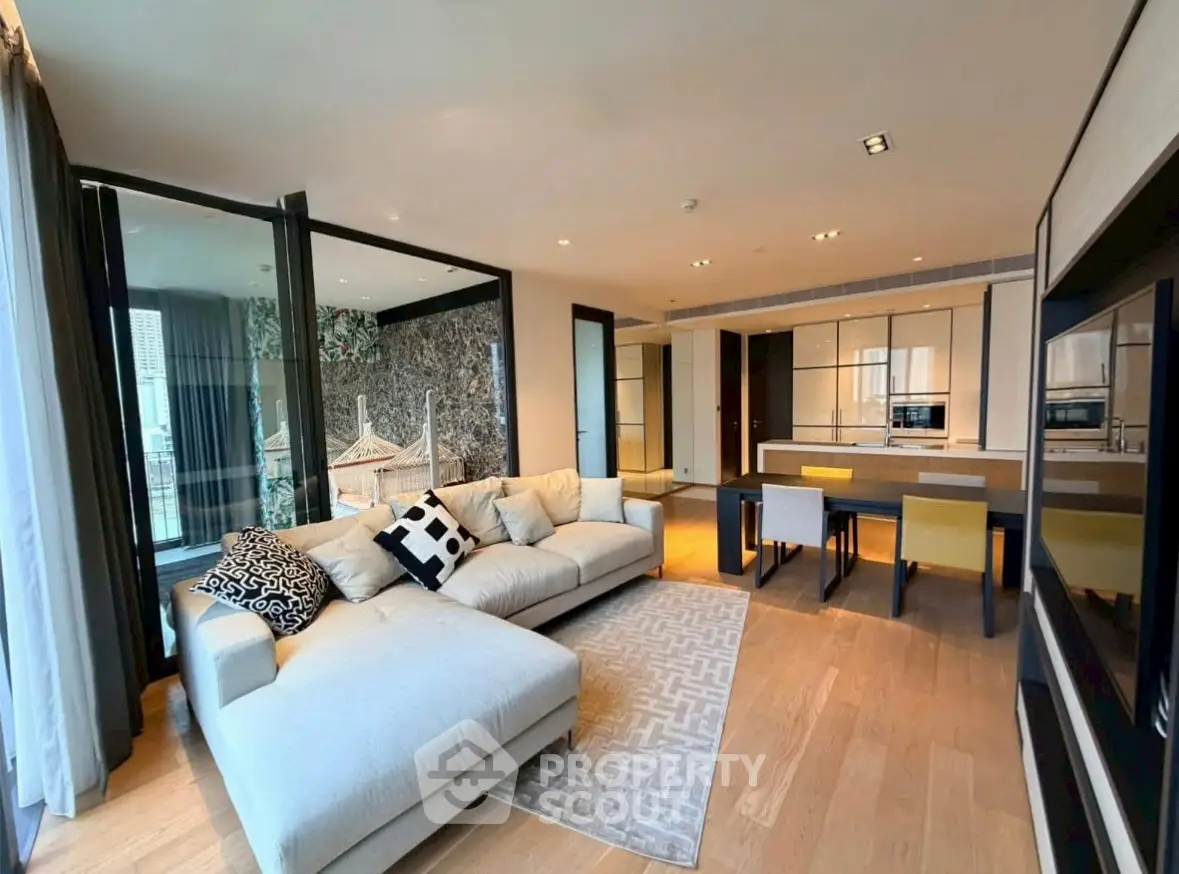 Luxurious open-plan living room with modern kitchen and elegant decor