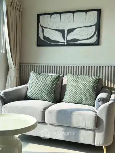 Cozy living room with stylish sofa and modern art decor