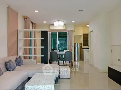 Spacious modern living room with open kitchen and elegant dining area