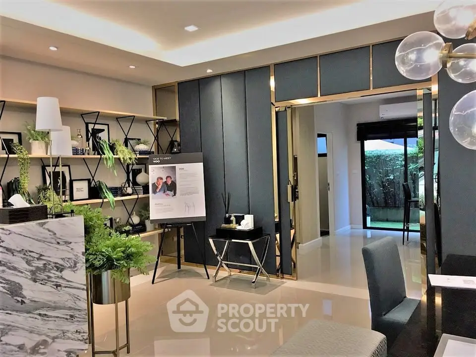 Luxurious modern living room with elegant decor and garden view, perfect for sophisticated urban living.